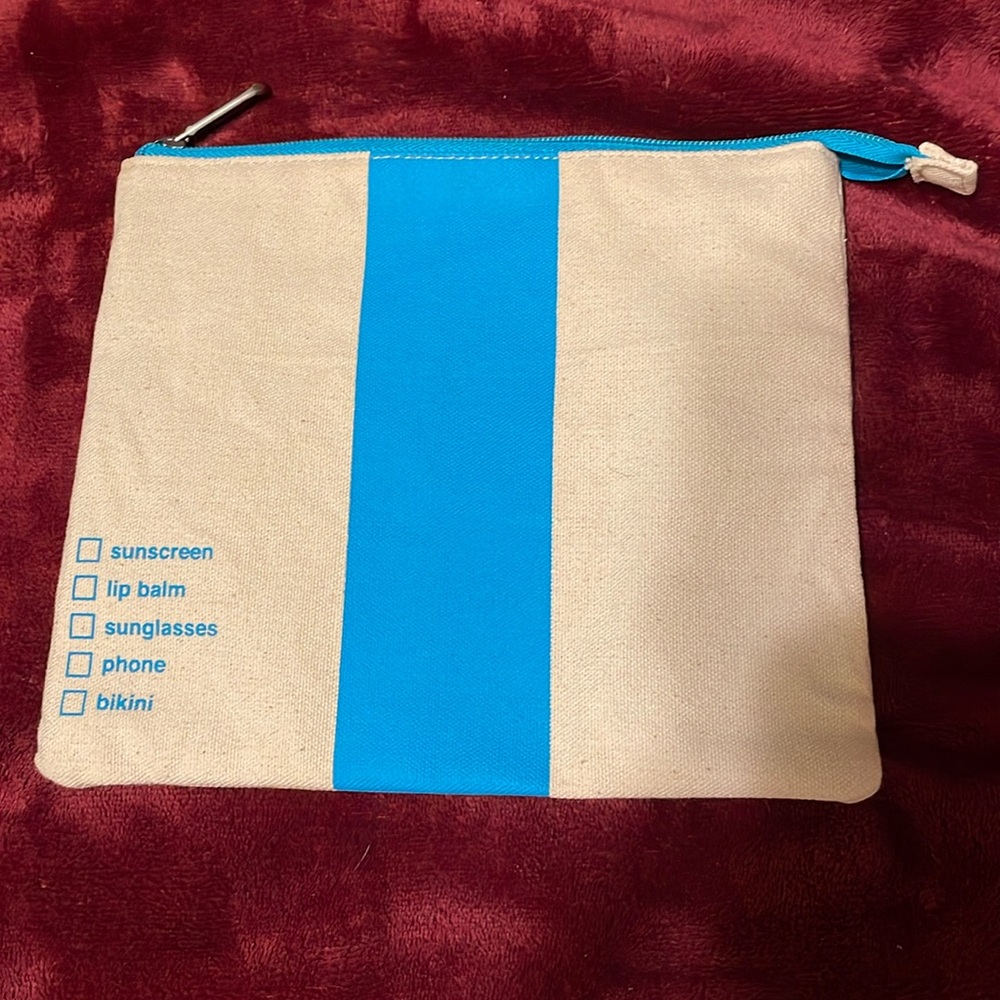 Joyus canvas travel bag - it is an ivory color w/teal stripe down the middle
